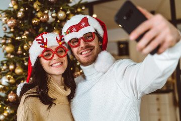 Cinematic image of a couple celebrating christmas at home.