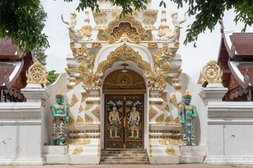 Fototapeta premium Exterior view of gate to City Pillar Shrine with intricate decoration, Chiang Mai, Thailand