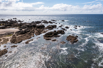 Landscape of the ocean and rocky coast in France, viewed from a drone.