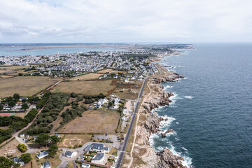 Landscape of the ocean and rocky coast in France, viewed from a drone.