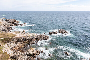 Landscape of the ocean and rocky coast in France, viewed from a drone.