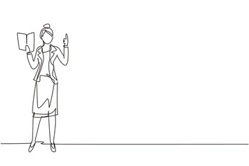 Single continuous line drawing young woman professor standing in front of class with book on her hands, female teacher students in classroom at school. One line draw graphic design vector illustration