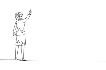 Continuous one line drawing rear view of woman teacher or student writing formulas on classroom chalkboard holding chalk in right hand. University or school education. Single line draw design vector