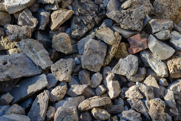 Construction debris full frame. Random rocks, bricks, pieces of