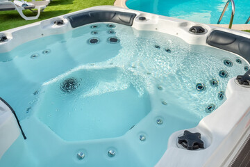Luxury bathtub, jacuzzi for therapeutic massage and relaxation outside.