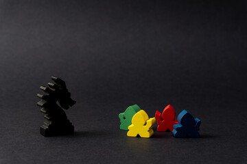 Dragon and warrior meeples. Board game.
