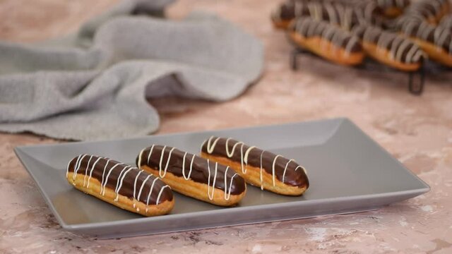 French dessert eclair with chocolate and custard. Traditional French dessert.