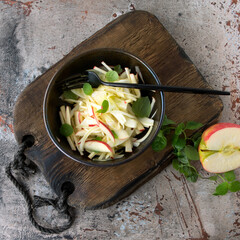 bowl of veggie salad with fennel and apple on the table - obrazy, fototapety, plakaty