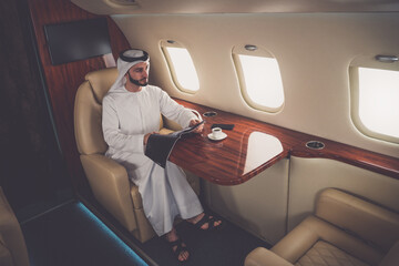 Business man from united arab emirates flying on his private jet to Dubai