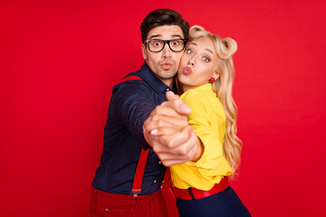 Photo of funny beautiful young lady guy dressed pinup outfits sending you kiss dancing jazz isolated red color background