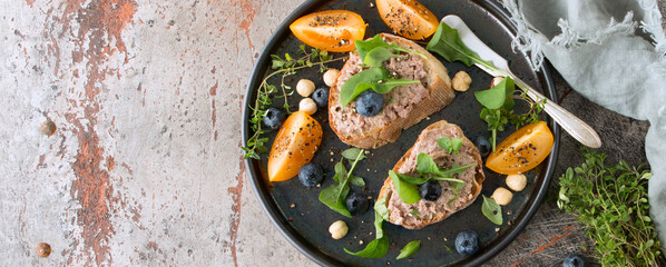 bruschettas with duck pate on the table
