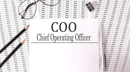 Papers with text, COO - Chief Operating Officer on the table, business concept. - obrazy, fototapety, plakaty