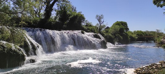Fototapeta premium Waterfall landscape.A beautiful waterfall in untouched nature.Trebižat River Waterfall, Bosnia and Herzegovina.