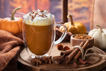 Pumpkin spice latte with autumn background
