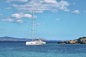 Luxury yacht moored on open sea. Transportation, travel, sport, recreation, leisure activity.