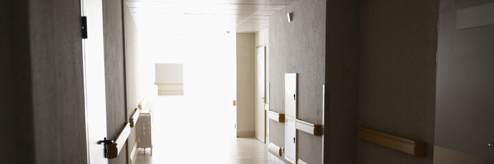 Empty modern corridor in hospital with bright light background