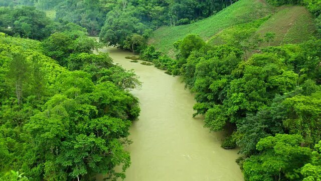 An aerial 4K footage of a river in the middle of Jungle in Alta Verapaz near Lanquin in Guatemala