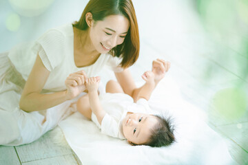 Obraz na płótnie Canvas 室内で遊ぶお母さんと赤ちゃん