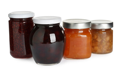 Jars with different jams on white background