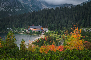 Autumn by lake in High Tatras, Turistic and Hiking photo. Colorful Scenery. Edit space. Popradske lake