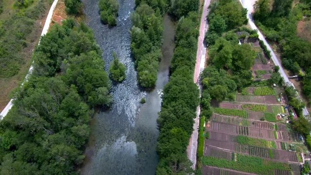 An aerial view of a river and medieval bridge in Aoiz, Navarra, Pamplona, Spain