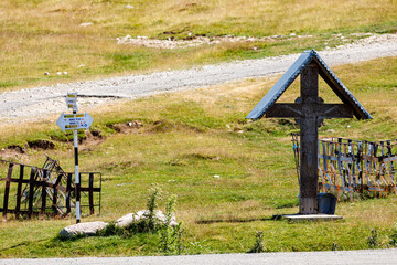 cross in the field at the transalpine road in the Carpathian Mountains of Romania 