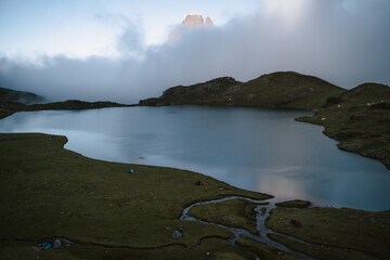 Ayous lake during a cloudy summer day with iconic Midi d'Ossau in the background