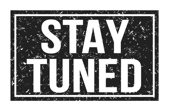 STAY TUNED, words on black rectangle stamp sign