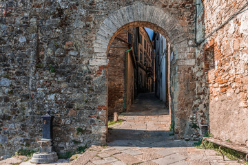 View of narrow street in Chiusdino, Tuscany, Italy. Copy space.