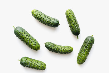 Cucumbers on a white background. Green cucumbers. Pimpled cucumbers. 
