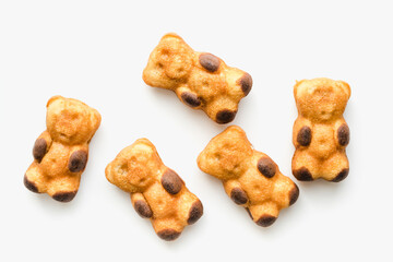 Wings on a plate. Dessert in the form of bears. Cookies on a white background. 