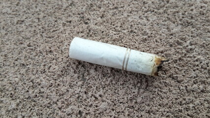 cigarette stub on the ground