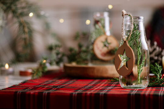 Christmas table setting with wreath and wooden ornaments