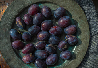 fresh plums in a bowl