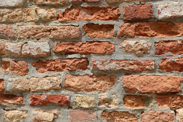 Wall made with lime and terracotta bricks that can be used as a background for a firewall
