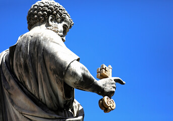 statue of St Peter in the Vatican and the hand holding the golden keys of Paradise according to the...