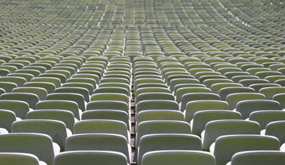 green seats in a sports facility without people