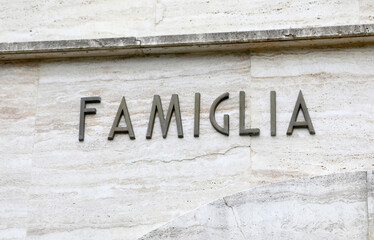 big text FAMIGLIA that means family in Italy