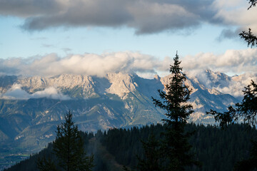 mystical autumn landscape in the mountains with view of the alps at the sunset