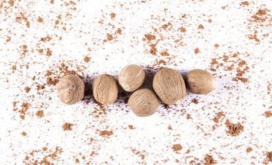 Pile ground, milled nutmeg powder isolated on white background, top view 