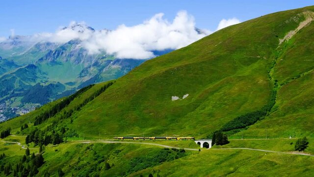 Yellow Railway from Lauterbrunnen to Kleine Scheidegg in the famous Swiss Alps. At the top of Europe.