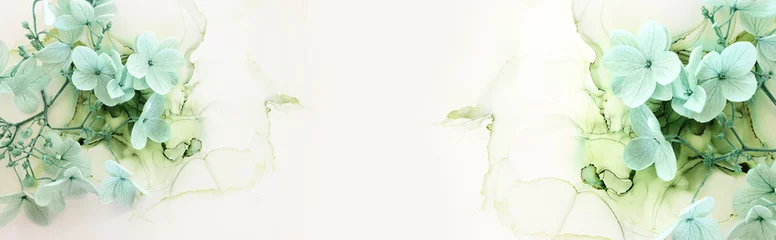 Schilderijen op glas Creative image of pastel mint green Hydrangea flowers on artistic ink background. Top view with copy space © tomertu
