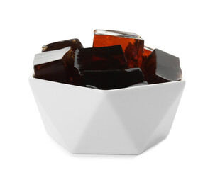 Delicious grass jelly cubes in bowl on white background