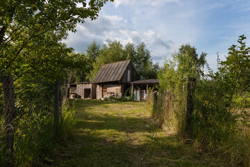 Fototapeta na wymiar Old wooden barn. Rural courtyard