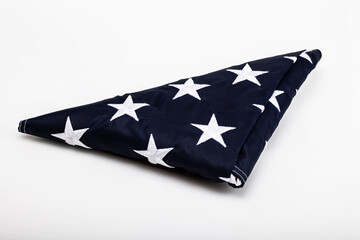 Folded American Flag on white background