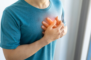 Man has chest pain. Concept of recurrent heart disease and lung disease.