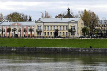 Naklejka premium Beautiful city landscape with a view of the embankment with old Russian buildings in autumn. Architecture of a small town. Tver. Russia