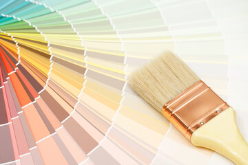 A painter is choosing a paint shade for the interior of the house's walls. with interior