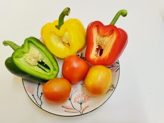 red and yellow peppers on a plate