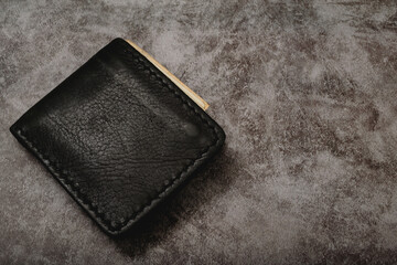 Wallet with Plan your finances in advance, such as having 3-6 months of savings, buying insurance, and generating income in many ways. debt planning